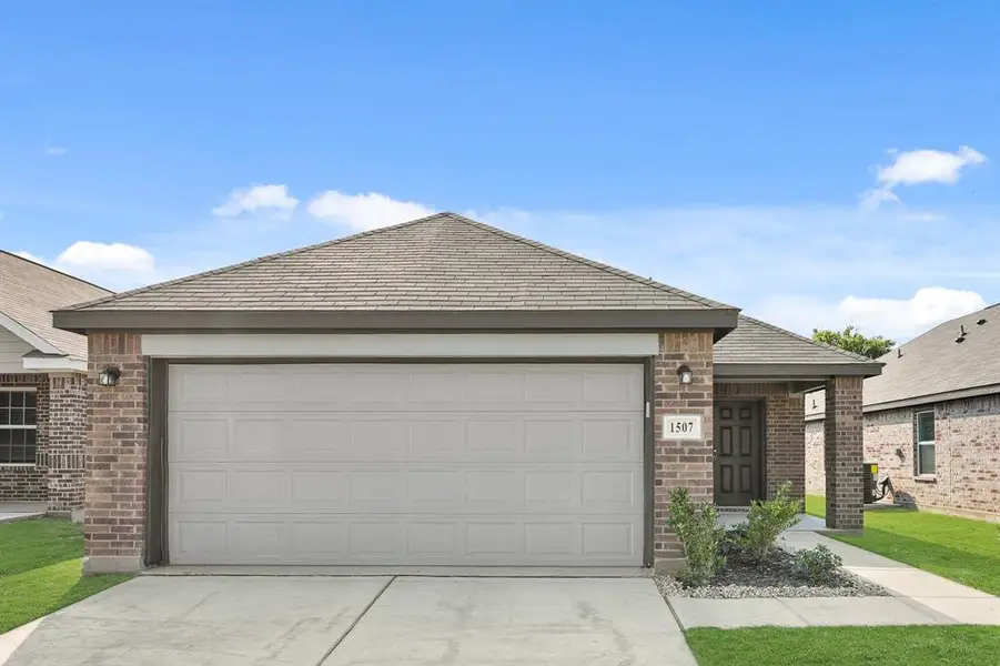 Front exterior of a new home in Christian Meadows, Ennis, TX, highlighting curb appeal (Image 1). Front exterior of a new home in Christian Meadows, Ennis, TX, highlighting curb appeal (Image 1).