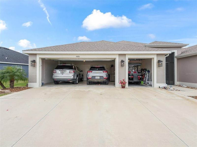 Garage expanded by 4 feet with 18 foot garage door, golf cart garage, and epoxy coating