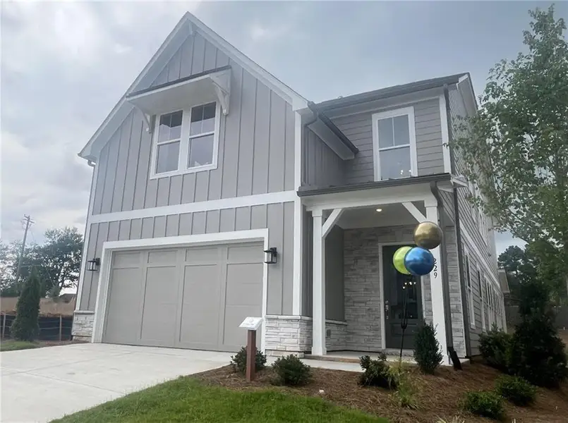 Front exterior of a new home in , Canton, GA, highlighting curb appeal (Image 1). Front exterior of a new home in , Canton, GA, highlighting curb appeal (Image 1).