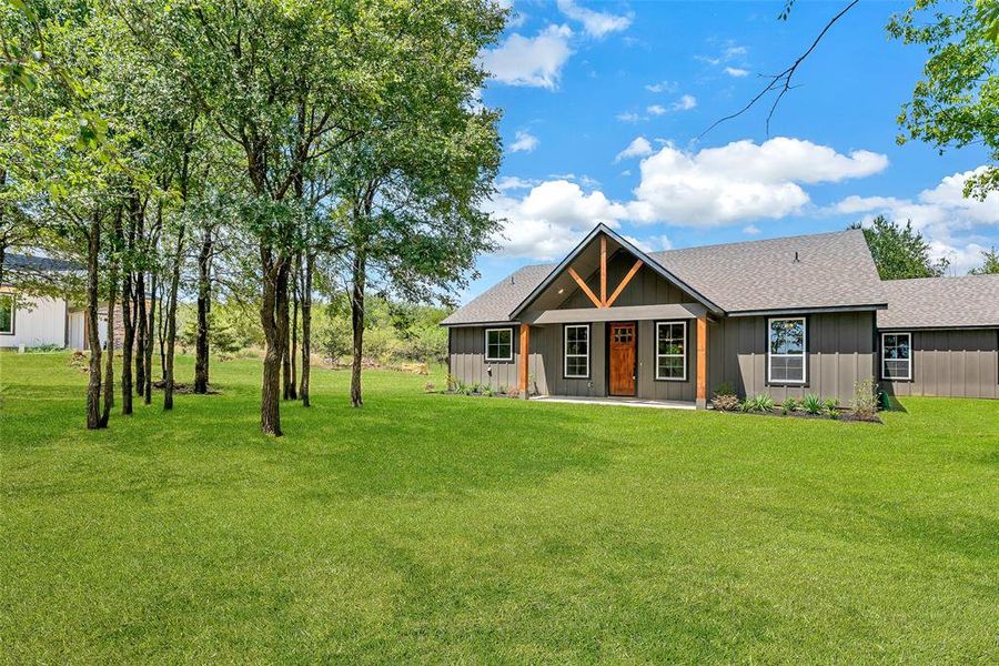 Front exterior of a new home in , Ennis, TX, highlighting curb appeal (Image 2). Front exterior of a new home in , Ennis, TX, highlighting curb appeal (Image 2).