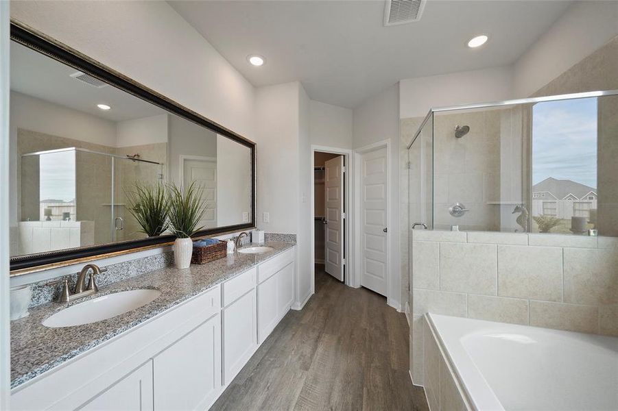 Spacious Owner’s Bath with Dual Vanities for Added Comfort