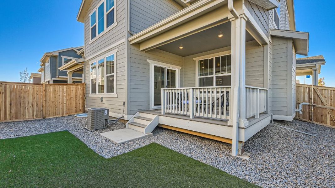 Covered deck leading to a lawn