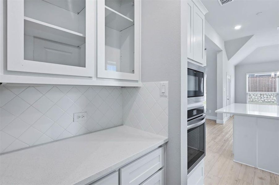 Visual of the butler’s pantry, coffee bar, and dry bar area offering additional storage, prep space, and everyday convenience.