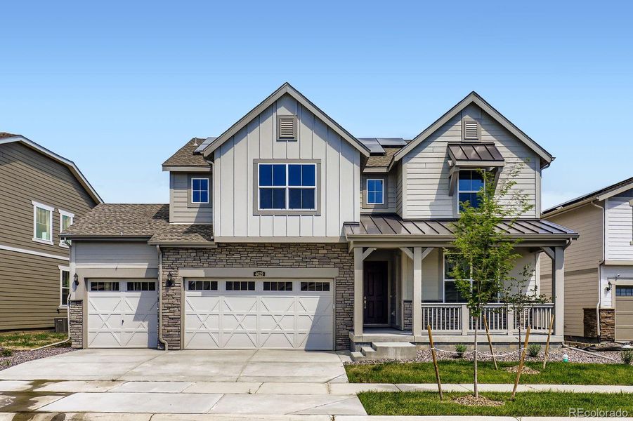 Front exterior of a new home in Brighton Crossings: The Grand Collection, Brighton, CO, highlighting curb appeal (Image 1).