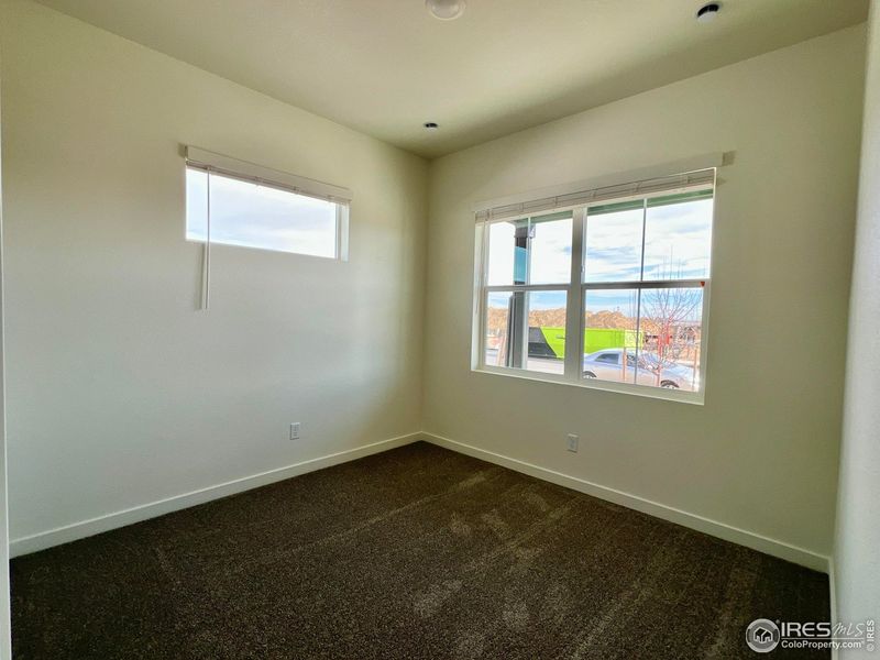 Spacious, unfurnished interior of a new home in Union Colony West, Greeley (Image 19).