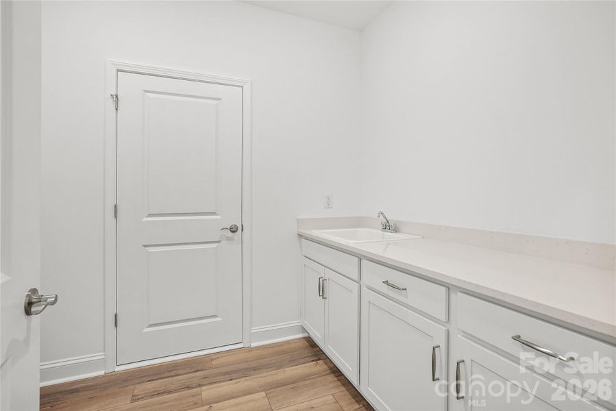 Convenient, large laundry room with cabinet/countertop/sink package Convenient, large laundry room with cabinet/countertop/sink package
