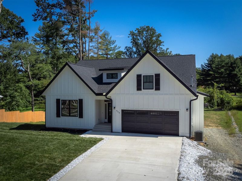 Front exterior of a new home in , Hendersonville, NC, highlighting curb appeal (Image 27).