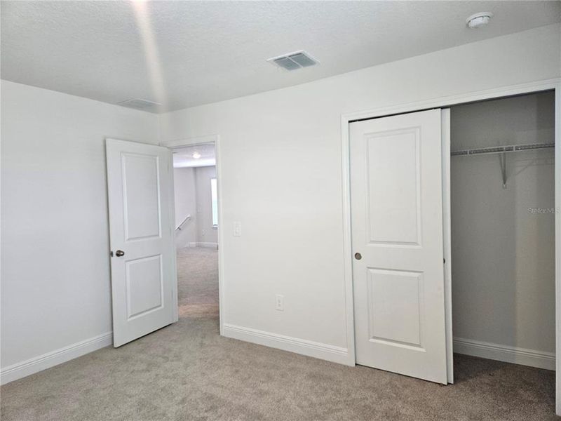 Spacious, unfurnished interior of a new home in The Reserve at Hammock Oaks - Classic Series, Lady Lake (Image 32).