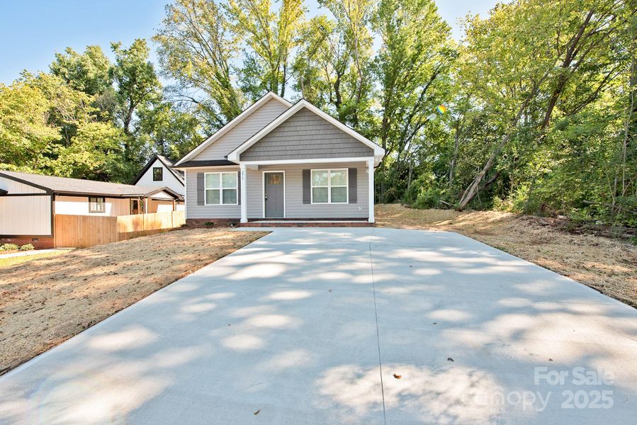 Front exterior of a new home in , Concord, NC, highlighting curb appeal (Image 2). Front exterior of a new home in , Concord, NC, highlighting curb appeal (Image 2).