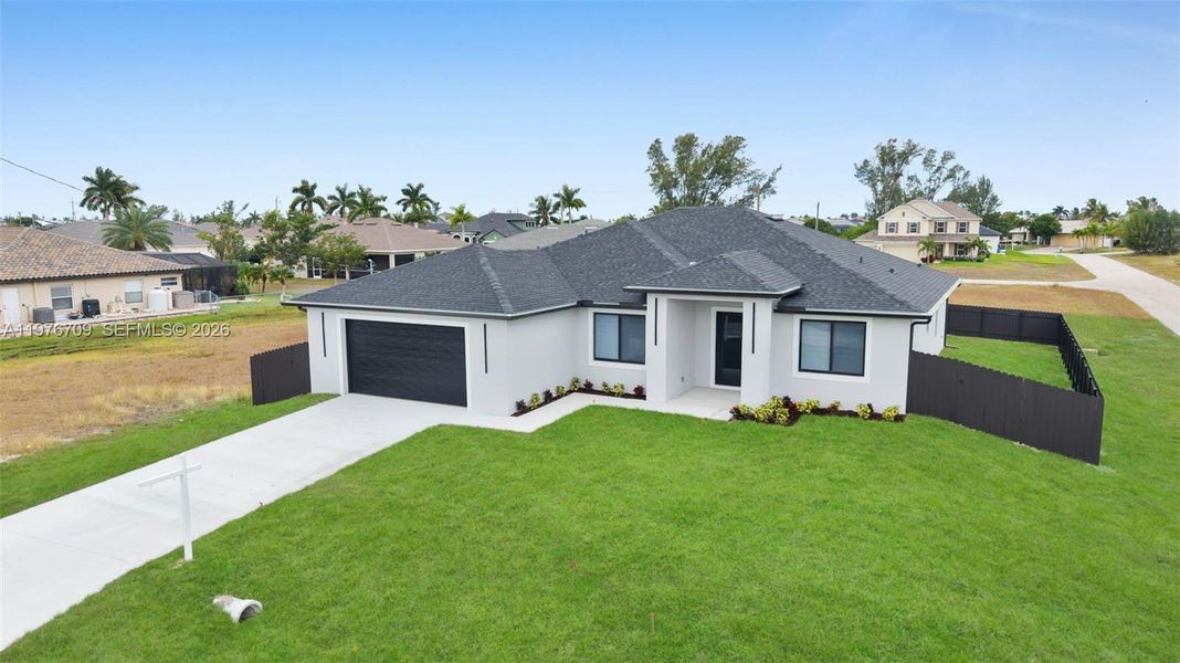 Front exterior of a new home in , Cape Coral, FL, highlighting curb appeal (Image 25).