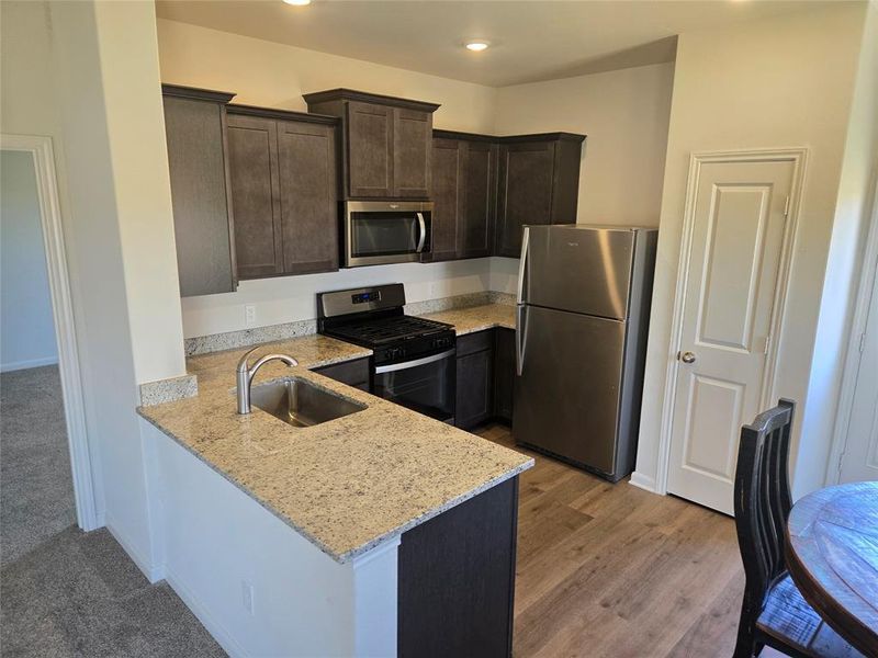 Furnished interior view inside a new home in Big Sky Estates, Ponder (Image 4).
