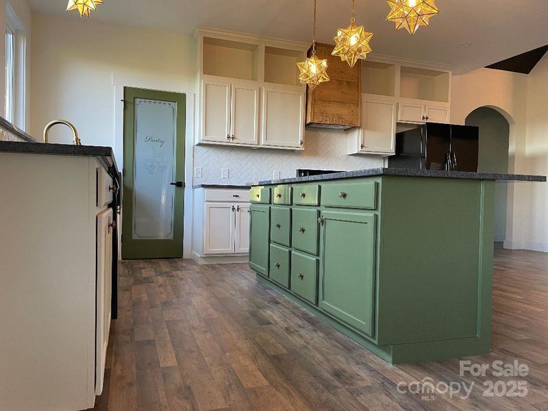 Meticulous in design, prep space, storage and open shelving.