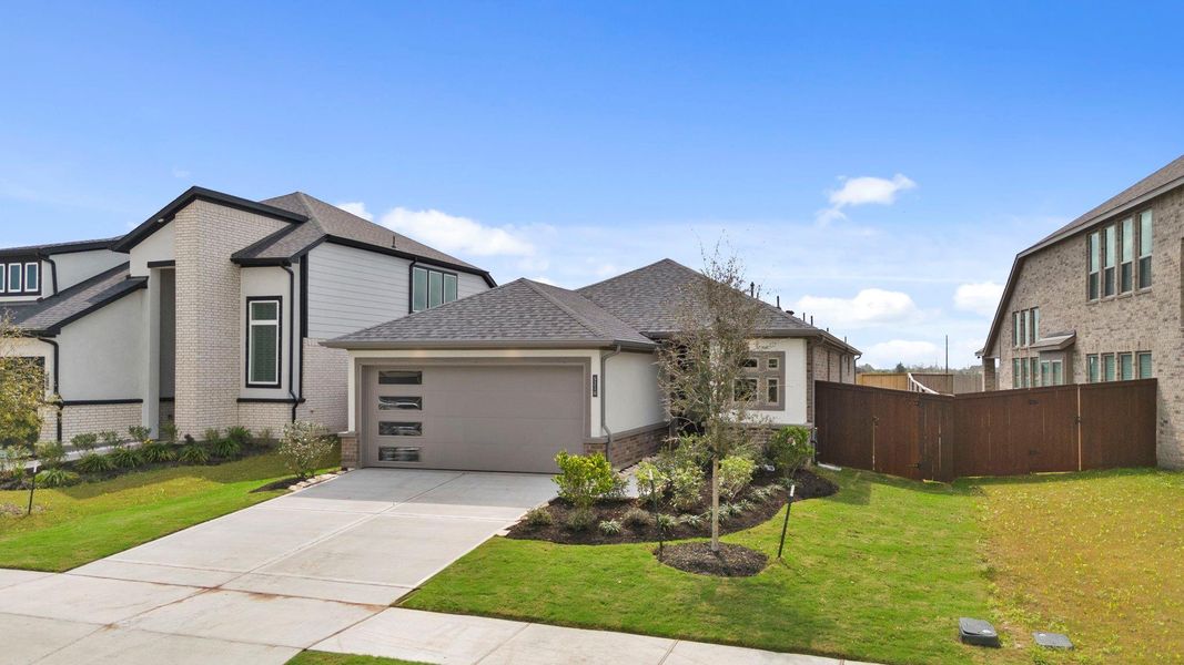 Front exterior of a new home in Meridiana 40', 65', Iowa Colony, TX, highlighting curb appeal (Image 2). Front exterior of a new home in Meridiana 40', 65', Iowa Colony, TX, highlighting curb appeal (Image 2).