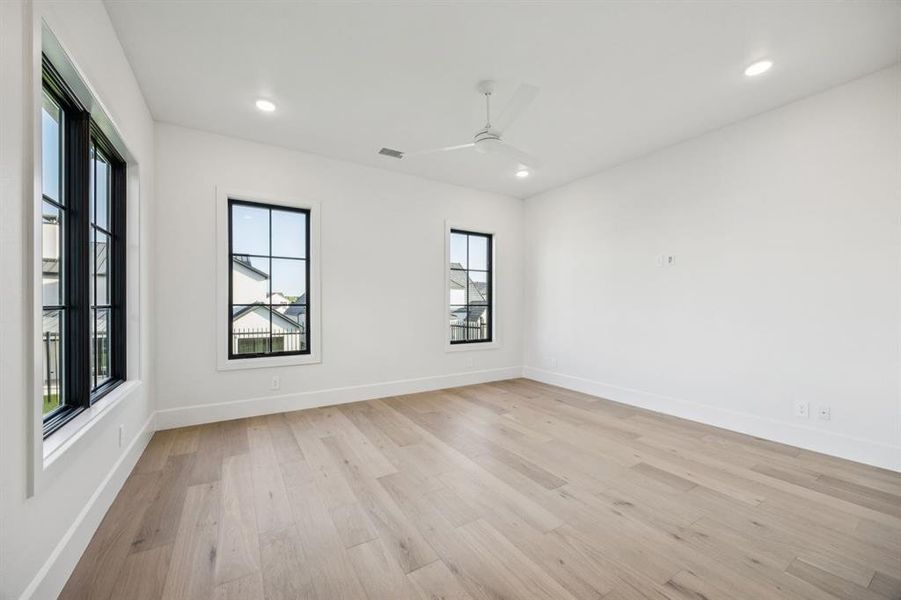 Unfurnished room with light wood-type flooring, recessed lighting, and ceiling fan Unfurnished room with light wood-type flooring, recessed lighting, and ceiling fan