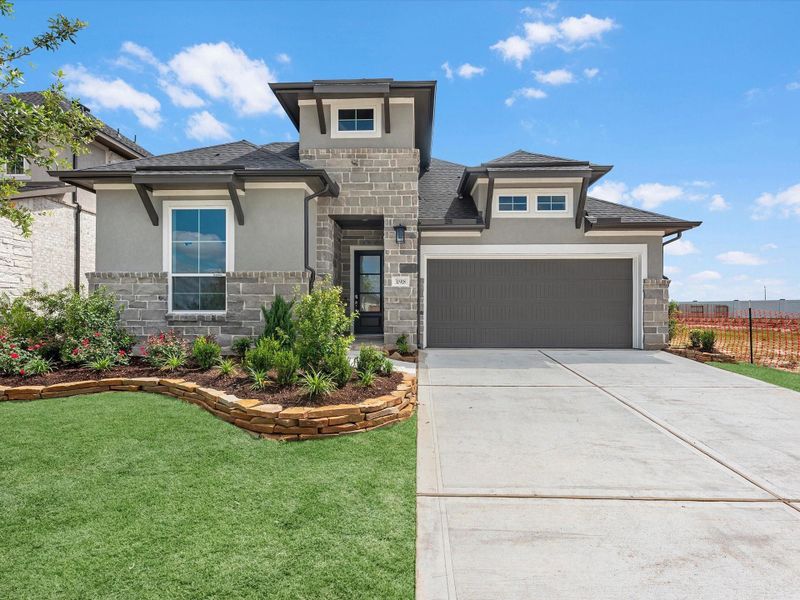 Front exterior of a new home in Pecan Ridge, Fulshear, TX, highlighting curb appeal (Image 2). Front exterior of a new home in Pecan Ridge, Fulshear, TX, highlighting curb appeal (Image 2).