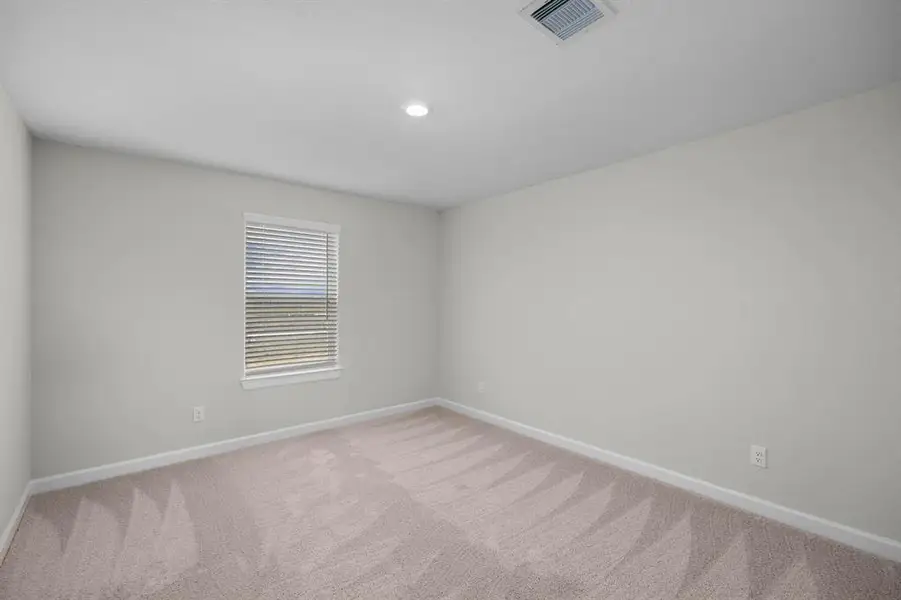 Large upstairs secondary bedroom.