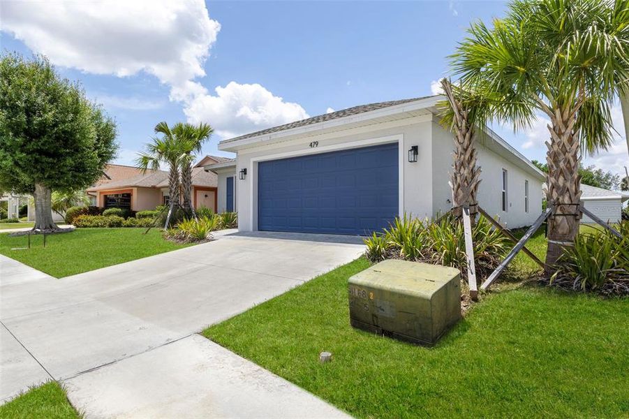 Front exterior of a new home in , Port Charlotte, FL, highlighting curb appeal (Image 24).