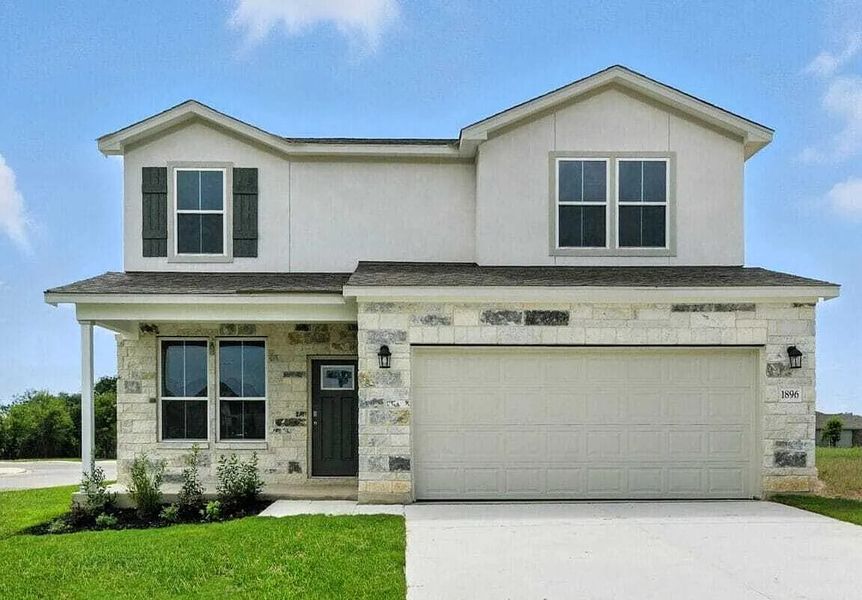 Front exterior of a new home in August Fields, New Braunfels, TX, highlighting curb appeal (Image 1). Front exterior of a new home in August Fields, New Braunfels, TX, highlighting curb appeal (Image 1).