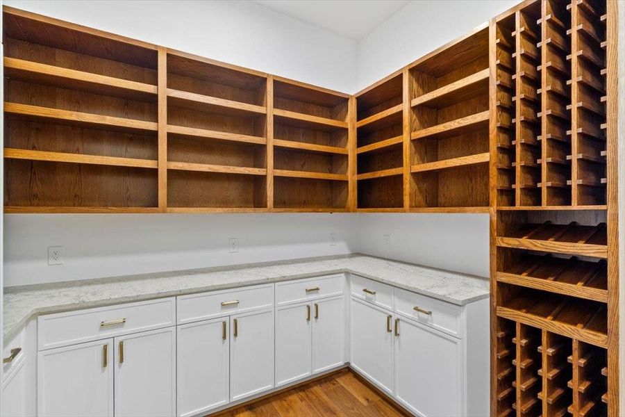 Opposite view of pantry with custom oak wine storage cabinet - this working pantry rivals most kitchens with counter space and storage on all sides