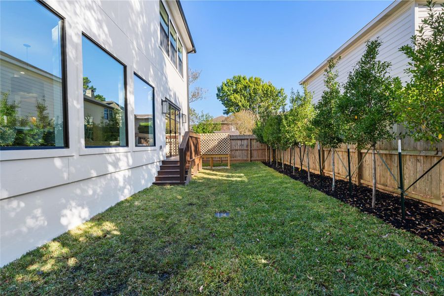 Exterior details and patio area of a home in , Houston (Image 4). Exterior details and patio area of a home in , Houston (Image 4).
