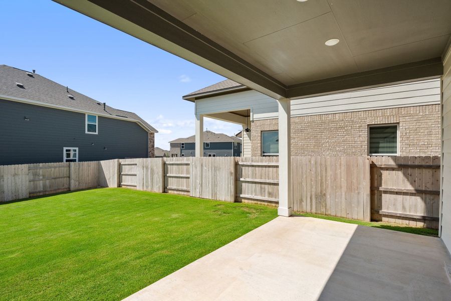 Exterior details and patio area of a home in Lariat, Liberty Hill (Image 27).