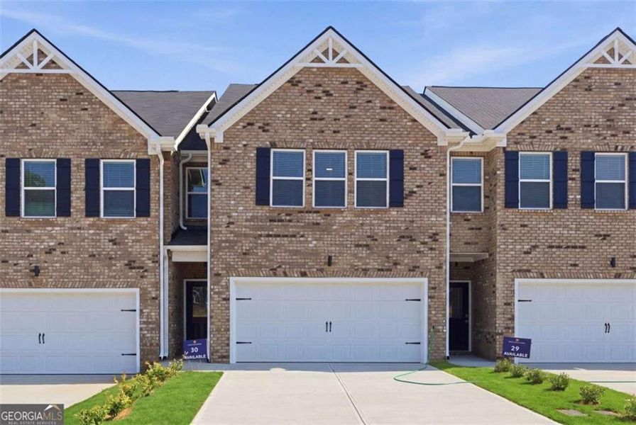 Front exterior of a new home in Parkway James, Snellville, GA, highlighting curb appeal (Image 2). Front exterior of a new home in Parkway James, Snellville, GA, highlighting curb appeal (Image 2).