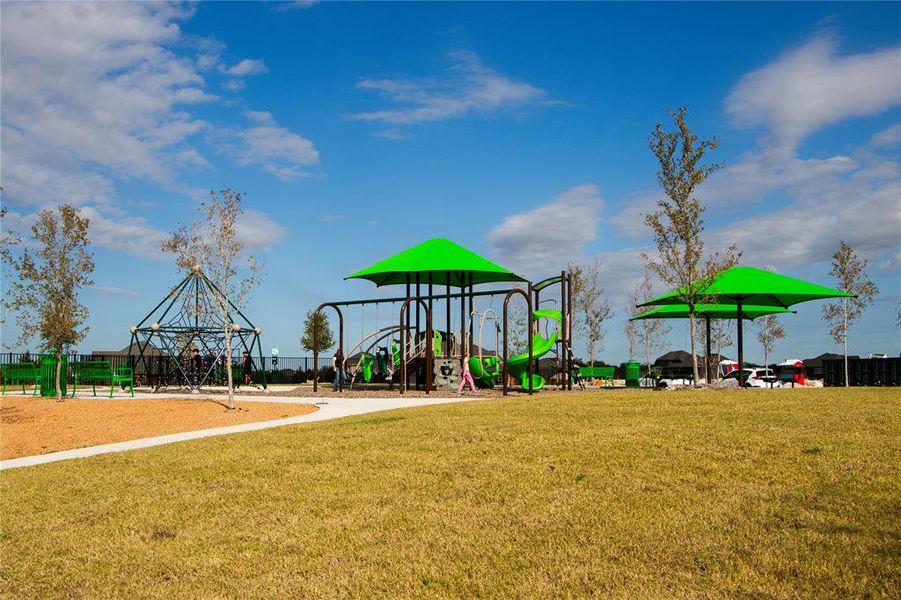 View of jungle gym featuring a lawn