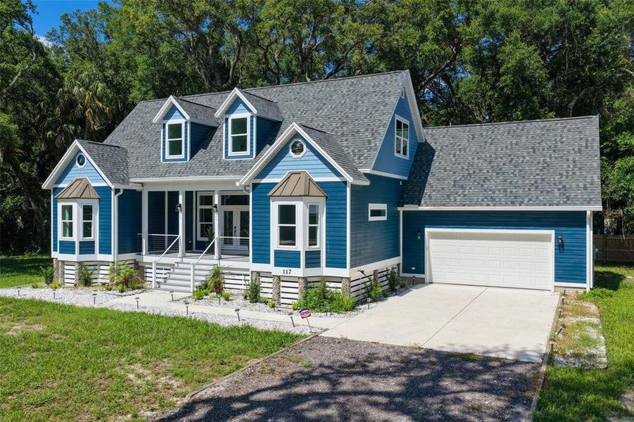 Front exterior of a new home in , Palm Coast, FL, highlighting curb appeal (Image 1). Front exterior of a new home in , Palm Coast, FL, highlighting curb appeal (Image 1).