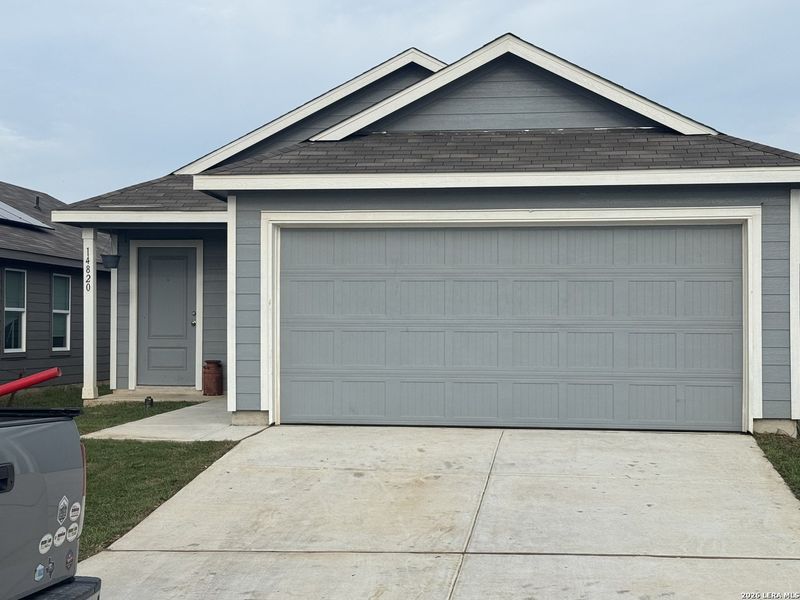 Front exterior of a new home in Stone Garden, Elmendorf, TX, highlighting curb appeal (Image 2).