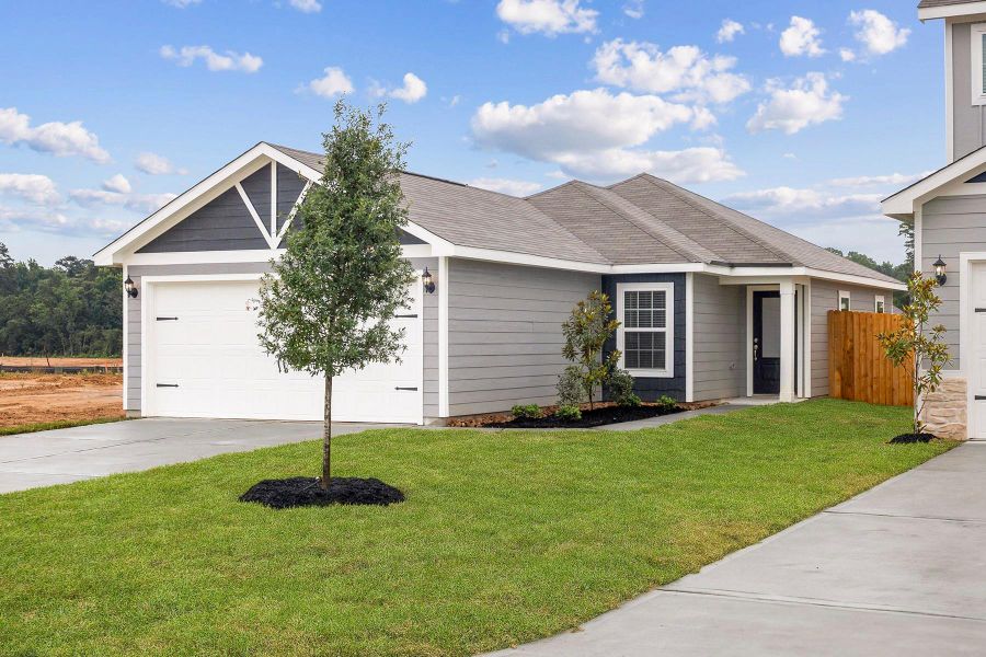 Front exterior of a new home in Magnolia Woods, Magnolia, TX, highlighting curb appeal (Image 20).