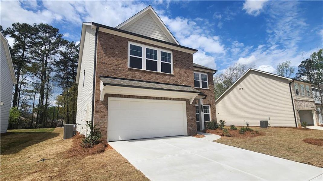 Front exterior of a new home in The Estates at Casteel, Bethlehem, GA, highlighting curb appeal (Image 17).