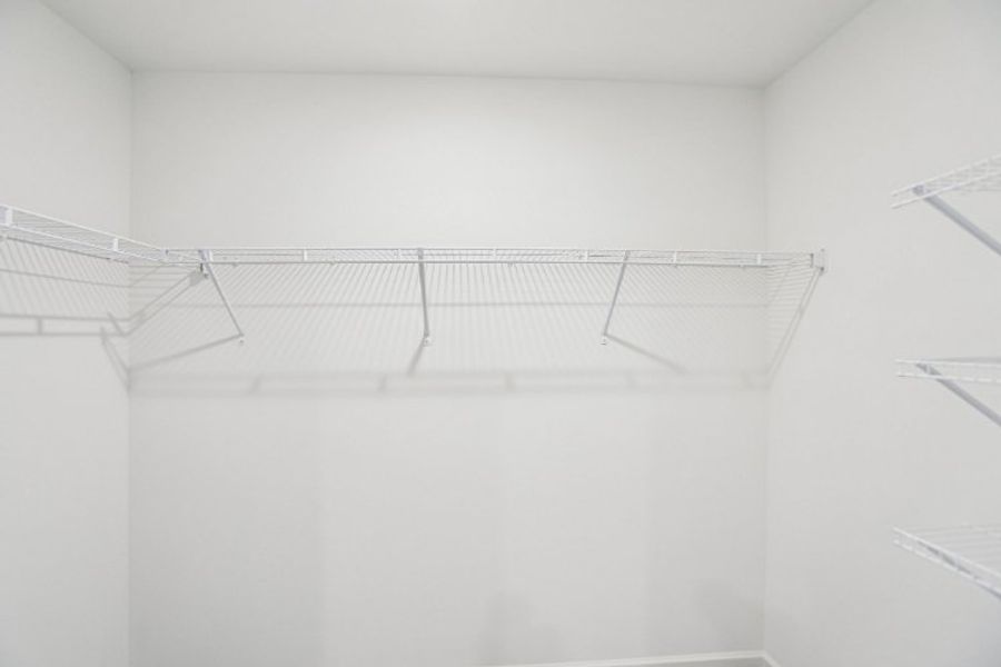 A white staircase in a room.