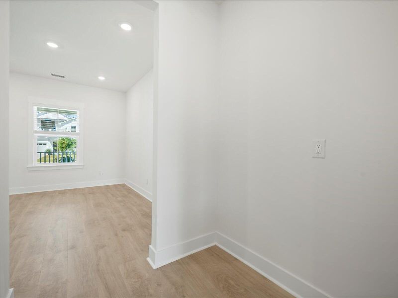 Spacious, unfurnished interior of a new home in The Coves at Lakes of Cane Bay, Summerville (Image 18).