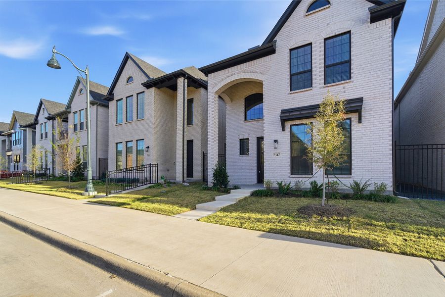 Front exterior of a new home in Craig Ranch, McKinney, TX, highlighting curb appeal (Image 2). Front exterior of a new home in Craig Ranch, McKinney, TX, highlighting curb appeal (Image 2).