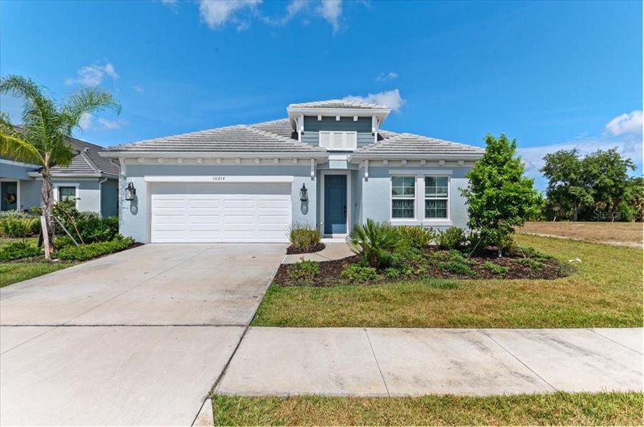 Front exterior of a new home in , Sarasota, FL, highlighting curb appeal (Image 23).