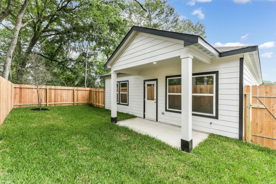 Front exterior of a new home in Caney Creek Place, Conroe, TX, highlighting curb appeal (Image 84).