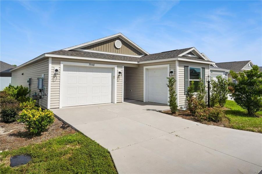 Front exterior of a new home in , The Villages, FL, highlighting curb appeal (Image 2). Front exterior of a new home in , The Villages, FL, highlighting curb appeal (Image 2).