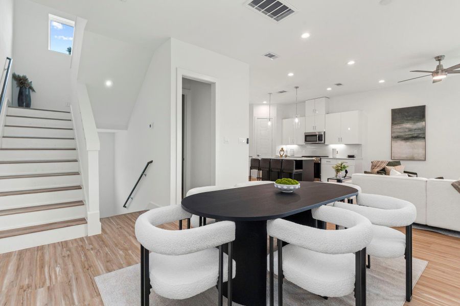 Seamlessly connected to the kitchen and living space, this dining area offers effortless flow for everyday living and entertaining