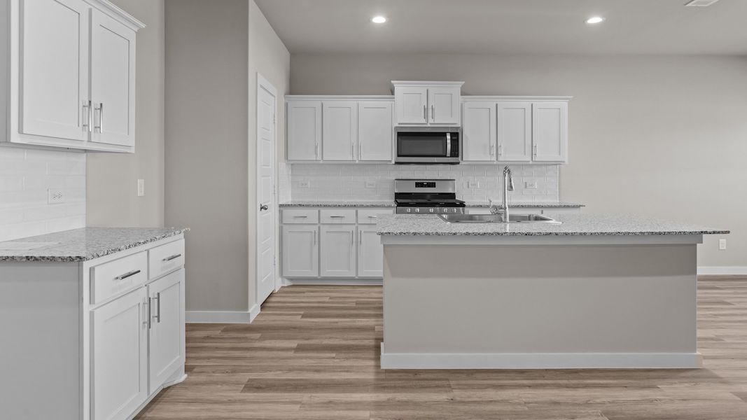 Representative furnished interior of a home built from the NAPLES by D.R. Horton in Homestead at Parks Bell Ranch, Odessa (Image 6).