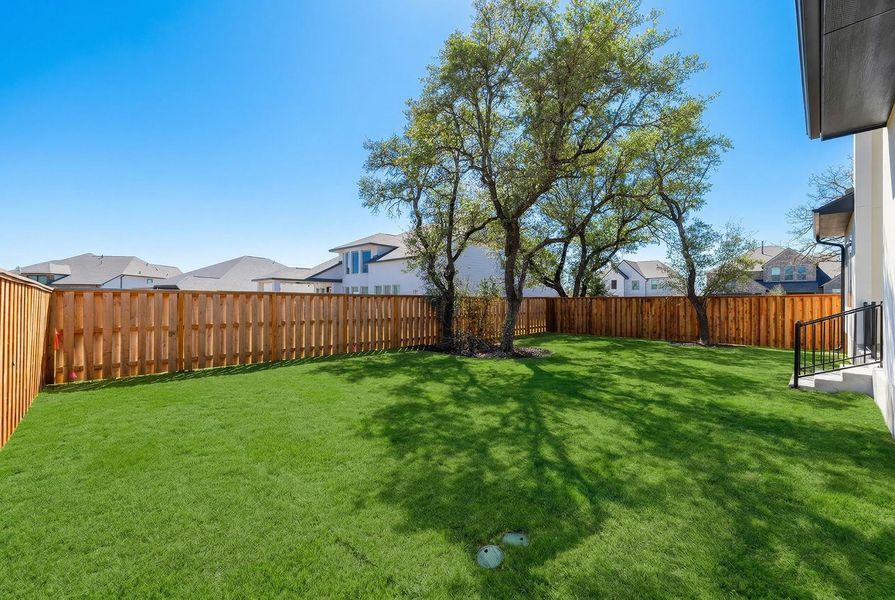 Exterior details and patio area of a home in Parmer Ranch 60, Georgetown (Image 14).