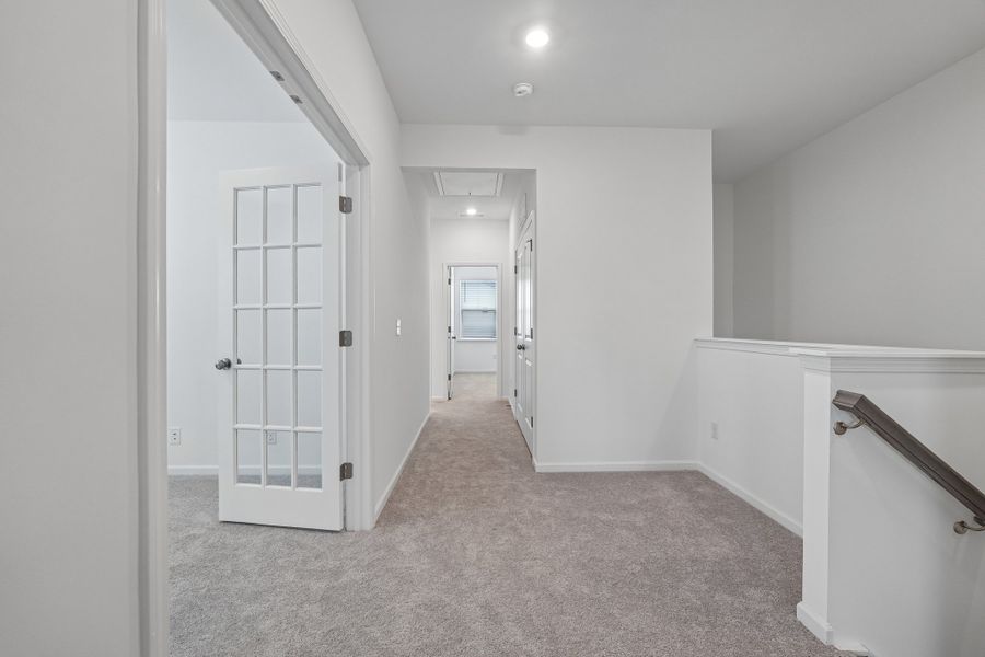 Spacious, unfurnished interior of a new home in Terraces at the Exchange, Indian Land (Image 28).