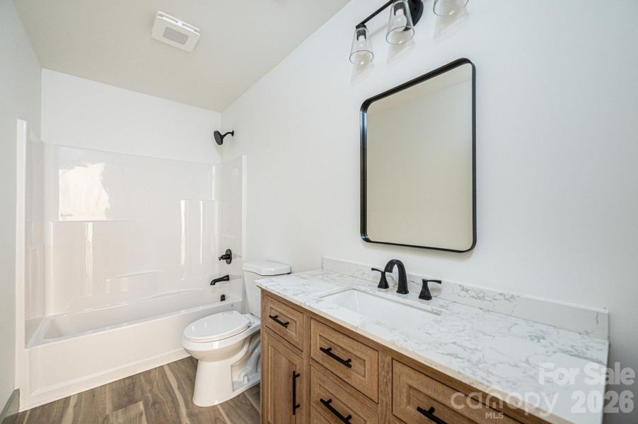 Hall bath with white oak vanity Hall bath with white oak vanity