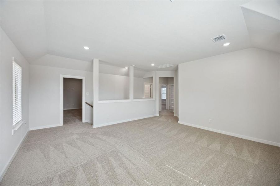 Game room in the Masters home plan by Trophy Signature Homes – REPRESENTATIVE PHOTO