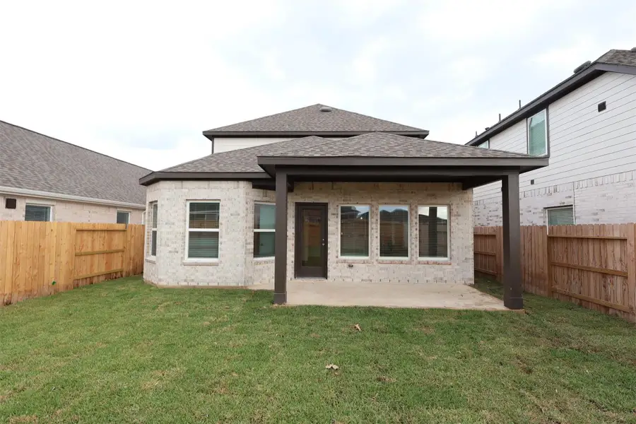 Exterior details and patio area of a home in Marvida, Cypress (Image 3).