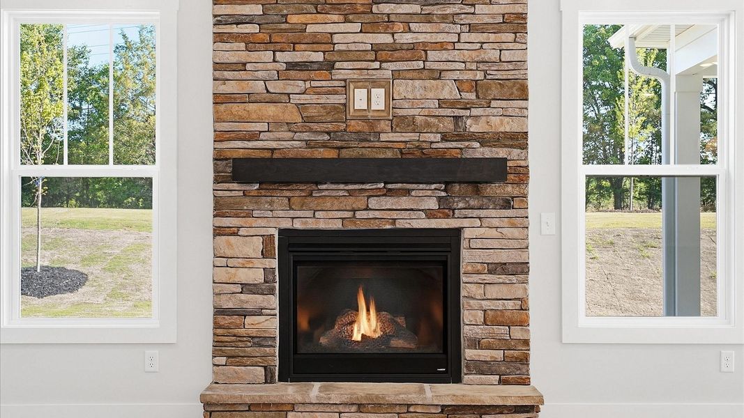 Superior design shines in this open-concept family room with a stone fireplace, timeless finishes and a modern edge in SC Superior design shines in this open-concept family room with a stone fireplace, timeless finishes and a modern edge in SC