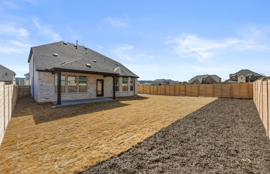 Exterior details and patio area of a home in Bluffview Reserve, Leander (Image 27).