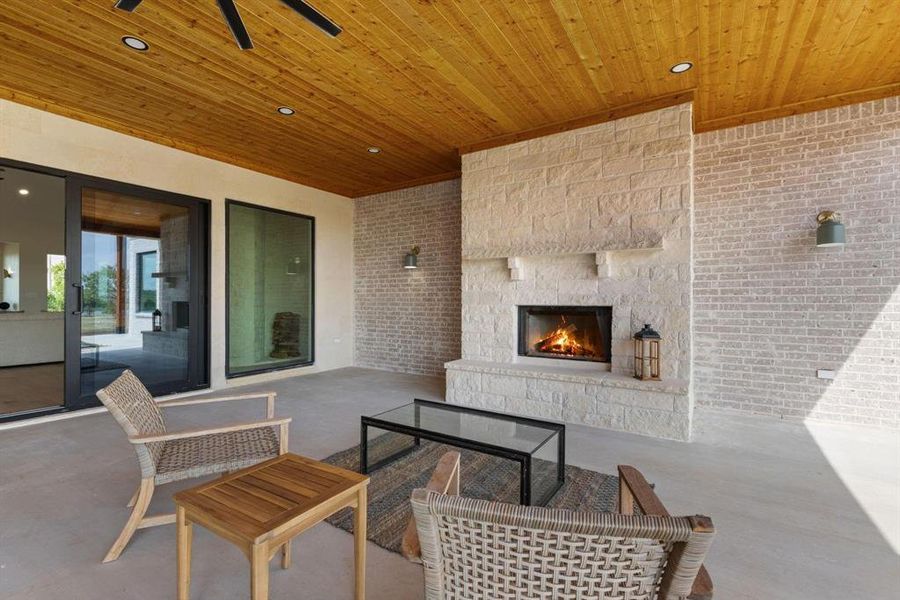 View of patio featuring an outdoor living space with
a fireplace View of patio featuring an outdoor living space with
a fireplace