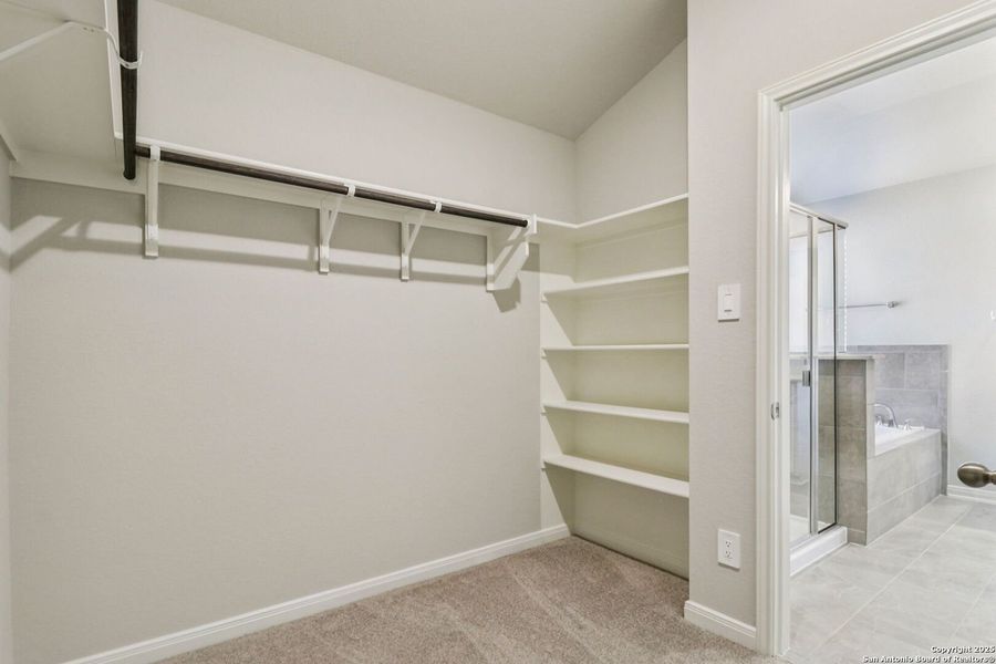 Spacious, unfurnished interior of a new home in Estancia Ranch - Premier Series, San Antonio (Image 28).