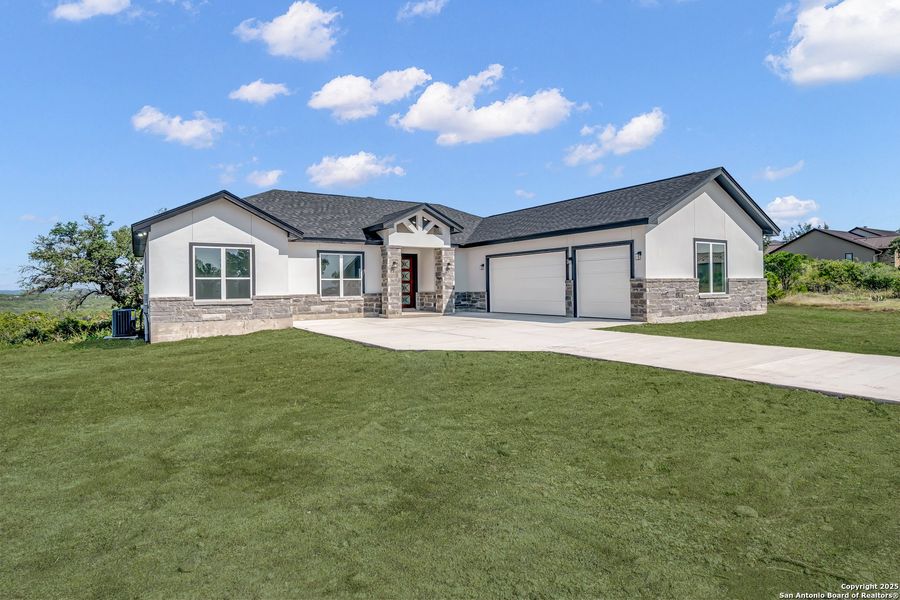 Front exterior of a new home in , Mico, TX, highlighting curb appeal (Image 2). Front exterior of a new home in , Mico, TX, highlighting curb appeal (Image 2).