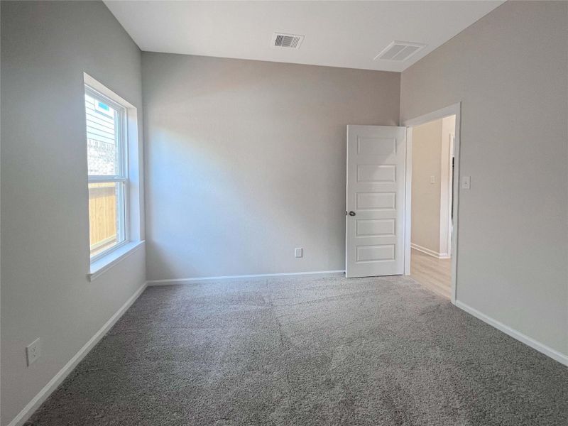 Secondary Bedroom. Home under construction. Sample floor plan photo used for illustrative purposes only. Upgrades, selections options, windows and colors may vary.